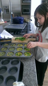 Making the egg muffins.